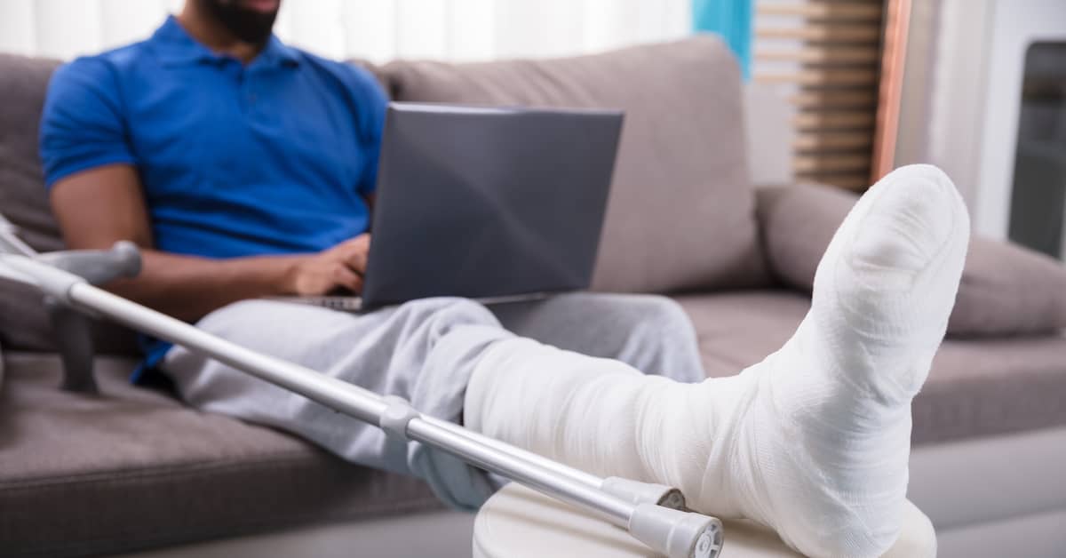 A man works remotely after an injury | Colling Gilbert Wright