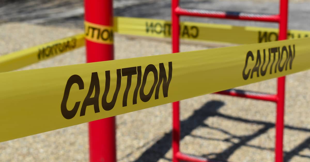 Caution tape around the most dangerous playground equipment. | Colling Gilbert Wright