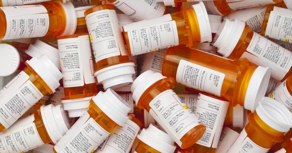 Discarded pill bottles of dangerous drugs. | Colling Gilbert Wright